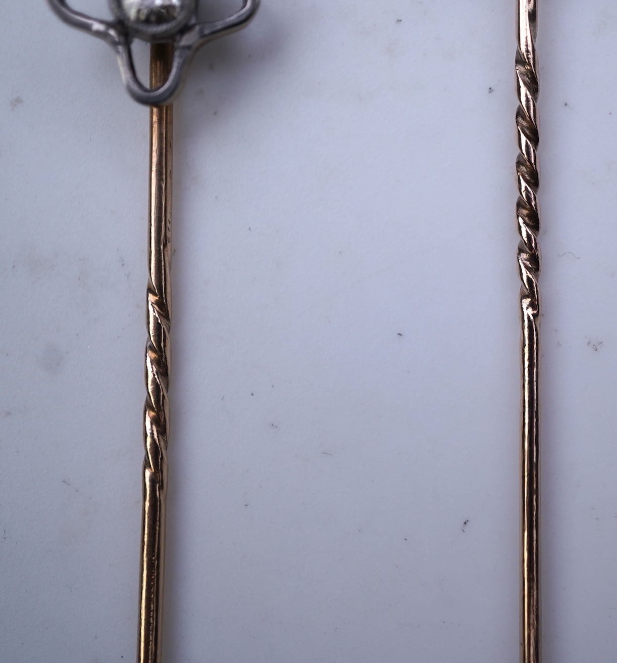 Two diamond stick pins, early 20th century